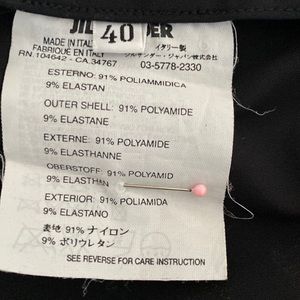 Adorable classic slim skirt. 10"front zipper leading to open pleat. 26" length